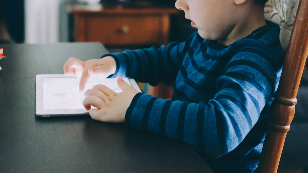 Child using a tablet computer at a table
