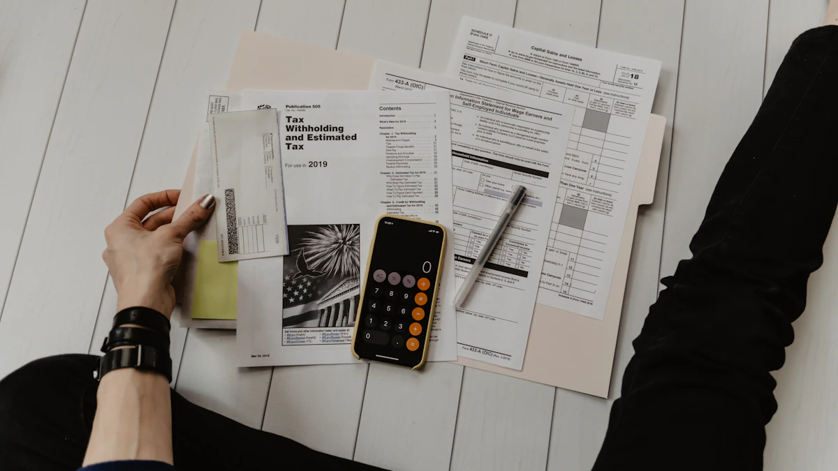 Calculator and financial documents used to review IT spend
