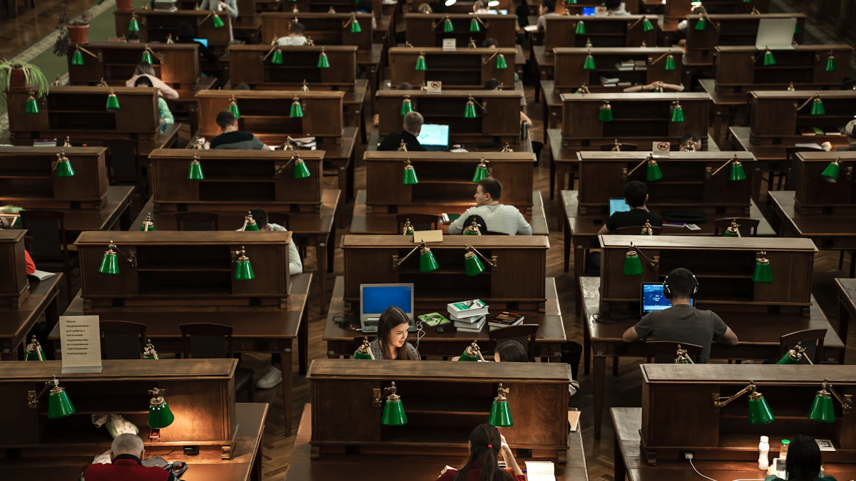 Students using computers in a library study hall