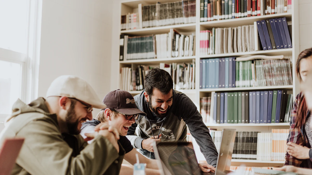Students using laptops together at a study table